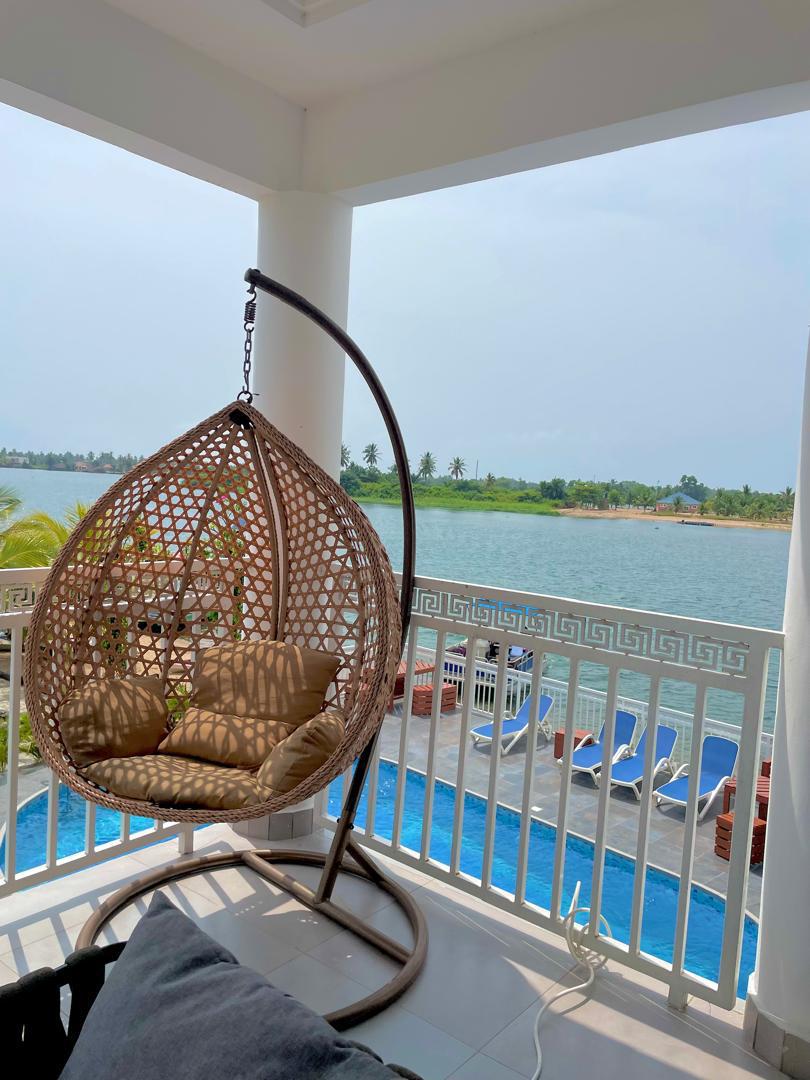 Waterfront at Ad Virgin Island Resort in Ada Foah, Ghana at dusk