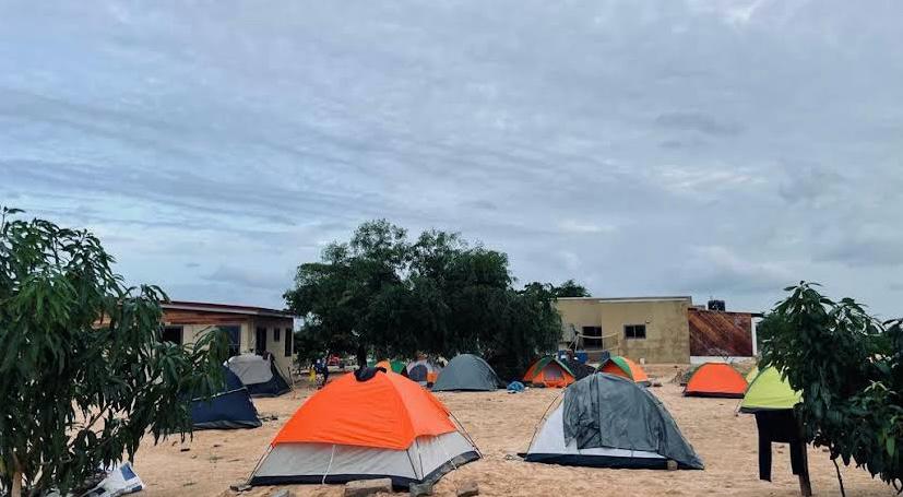 Beach camping tents on the sand at dusk