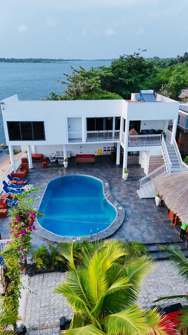Ad Virgin Island Resort pool and villa framed by bougainvillea